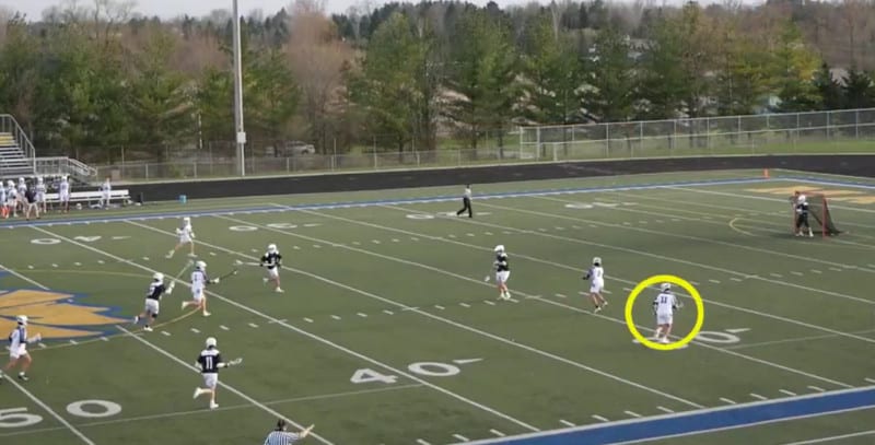Lacrosse recruiting video example with a yellow circle around the player to be identified.