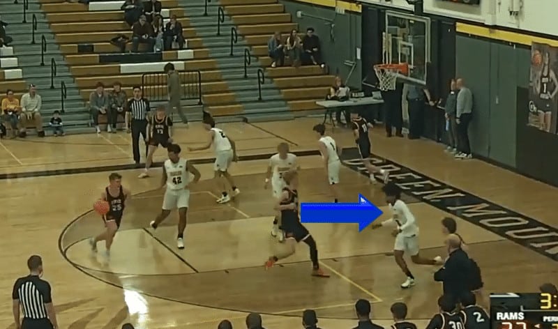 Example of sports recruiting videos by Chris Schieman Media. A blue arrow is pointed at the basketball player identified in this image.