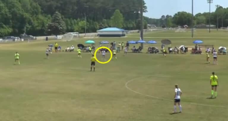 example of my Sports video editing Services, with a yellow circle around a soccer player going to steal a ball.