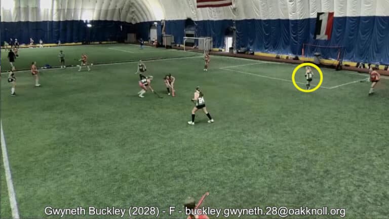 Example of a field hockey recruiting video, created by Chris Schieman. In the example image, the athlete is circled with a yellow circle as she is set to receive a pass.