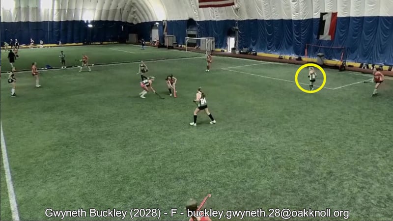 Example of a field hockey recruiting video, created by Chris Schieman. In the example image, the athlete is circled with a yellow circle as she is set to receive a pass.